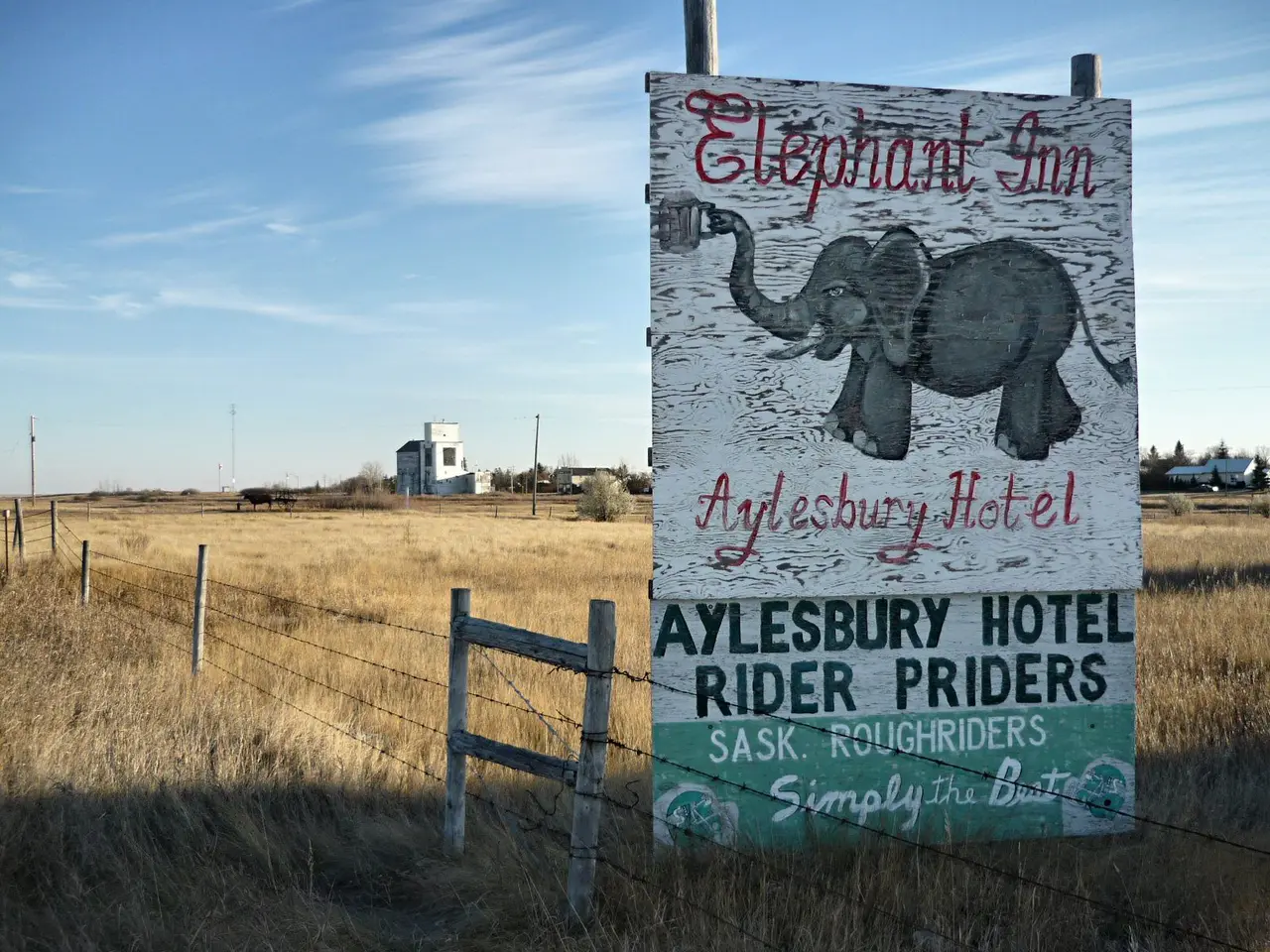 Elephant Inn sign with grain elevator in the distance, 2008